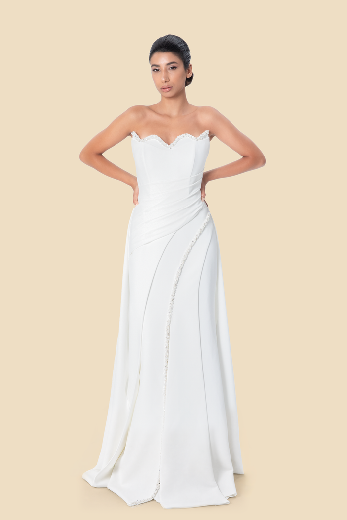 White strapless hand-beaded mermaid gown, front view, by Kerime Ataker